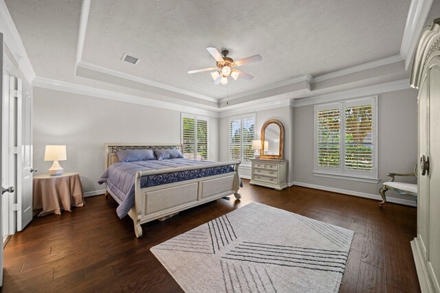 20002 Meadow Arbor Ct, Katy, TX 77450 - bedroom featuring a raised ceiling, dark wood-style flooring, baseboards, crown molding, and a ceiling fan