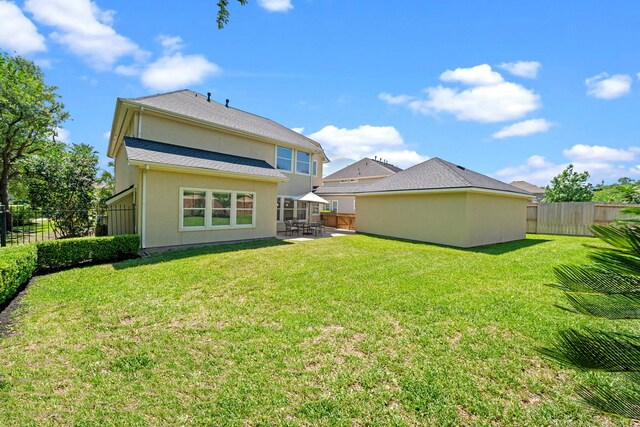 20002 Meadow Arbor Ct, Katy, TX 77450 - rear view of house with a patio and stucco siding