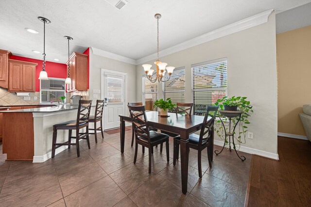 20002 Meadow Arbor Ct, Katy, TX 77450 - dining area with a chandelier, crown molding, baseboards, and recessed lighting