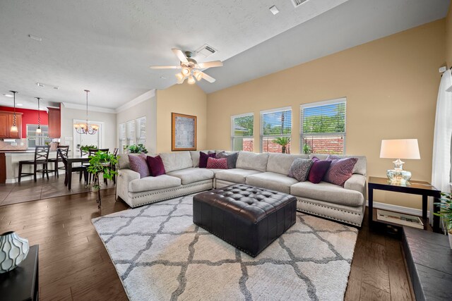 20002 Meadow Arbor Ct, Katy, TX 77450 - living area with healthy amount of natural light, wood finished floors, a chandelier, ceiling fan, and crown molding