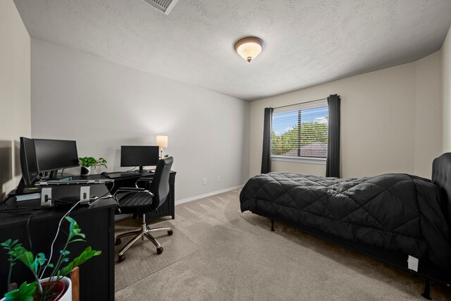 20002 Meadow Arbor Ct, Katy, TX 77450 - carpeted bedroom featuring an office area, baseboards, and a textured ceiling
