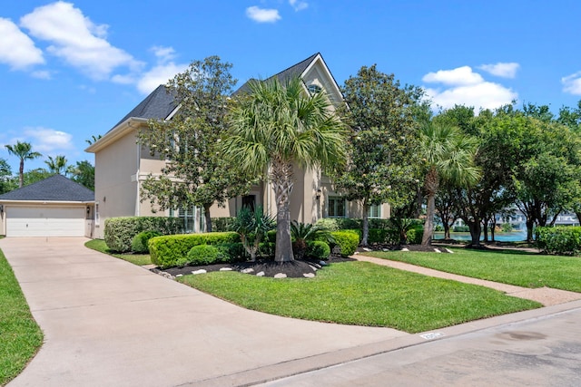 20002 Meadow Arbor Ct, Katy, TX 77450 - view of property hidden behind natural elements featuring stucco siding, a front yard, and driveway