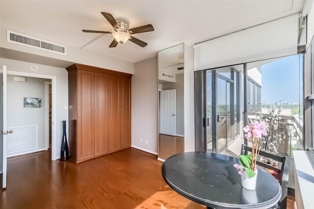 dining area featuring ceiling fan, wood finished floors, and baseboards