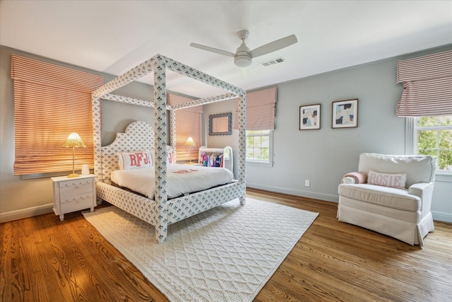 2618 Sunset Blvd, West University Place, TX 77005 - bedroom with baseboards, multiple windows, and wood finished floors
