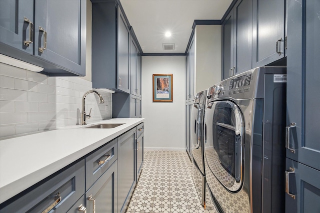 2618 Sunset Blvd, West University Place, TX 77005 - clothes washing area featuring washer and clothes dryer, cabinet space, baseboards, and ornamental molding