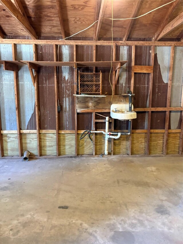 104 Crooked Creek Dr, Sheridan, TX 77475 - miscellaneous room with unfinished concrete floors and a sink