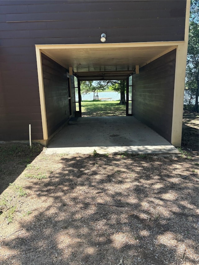 104 Crooked Creek Dr, Sheridan, TX 77475 - garage with a carport