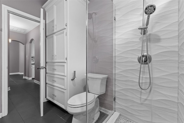 14834 Plantation Oak Dr, Houston, TX 77068 - full bath featuring tiled shower, toilet, tile patterned flooring, and baseboards