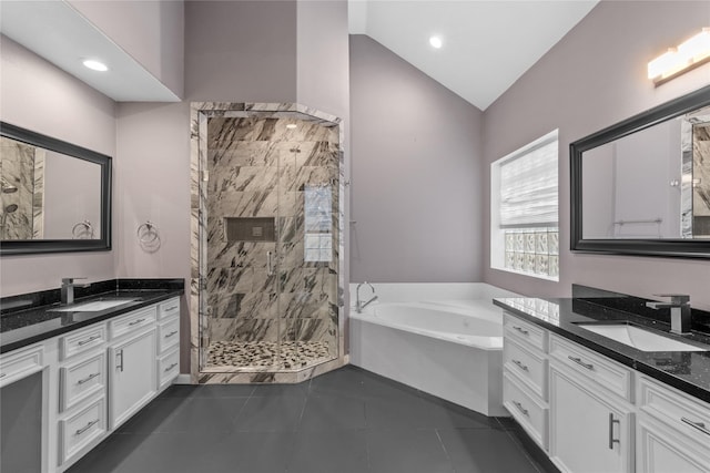 14834 Plantation Oak Dr, Houston, TX 77068 - full bath with a shower stall, lofted ceiling, a bath, two vanities, and tile patterned flooring