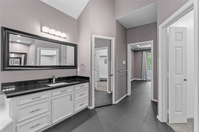 14834 Plantation Oak Dr, Houston, TX 77068 - bathroom with tile patterned flooring, vanity, and baseboards