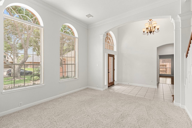 1807 Rustic Hills Ct, Sugar Land, TX 77479 - unfurnished room with light carpet, a chandelier, light tile patterned floors, crown molding, and arched walkways