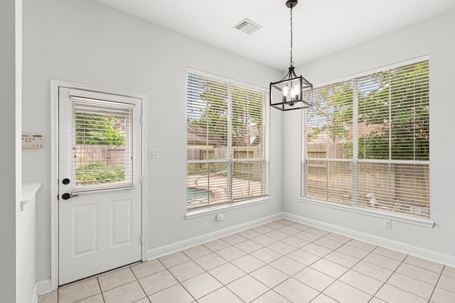 1807 Rustic Hills Ct, Sugar Land, TX 77479 - unfurnished dining area featuring a chandelier, plenty of natural light, and baseboards