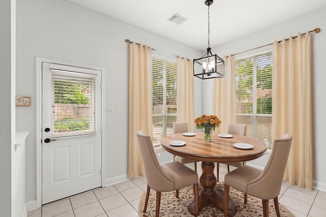 1807 Rustic Hills Ct, Sugar Land, TX 77479 - dining space with a chandelier, light tile patterned flooring, and healthy amount of natural light