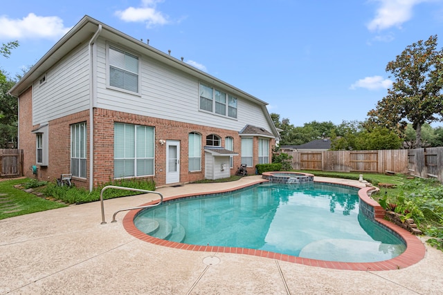 1807 Rustic Hills Ct, Sugar Land, TX 77479 - view of pool with a fenced backyard, a patio, and a pool with connected hot tub