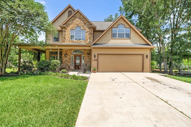 view of front facade featuring a front lawn, driveway, and stone siding