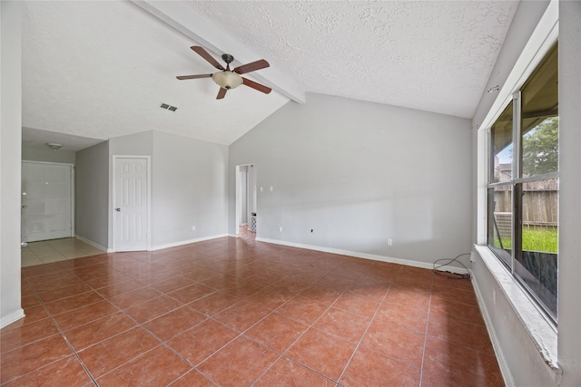 unfurnished room featuring tile patterned floors, ceiling fan, baseboards, and a textured ceiling