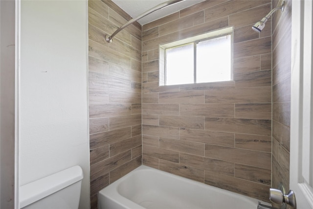 bathroom with toilet and tub / shower combination
