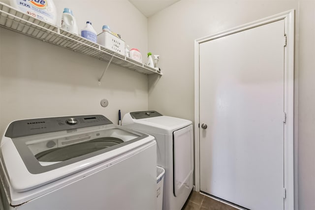 20810 Oak Rain Ct, Katy, TX 77449 - laundry room featuring washer and clothes dryer and dark tile patterned flooring