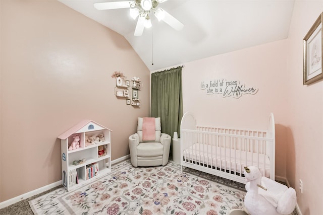 20810 Oak Rain Ct, Katy, TX 77449 - bedroom featuring a crib, lofted ceiling, baseboards, a ceiling fan, and carpet flooring