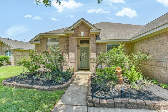 20810 Oak Rain Ct, Katy, TX 77449 - view of front of home with a shingled roof and brick siding