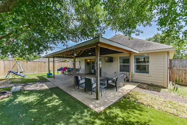 20810 Oak Rain Ct, Katy, TX 77449 - rear view of property featuring a shingled roof and a patio