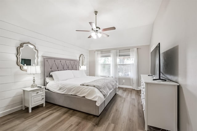 20810 Oak Rain Ct, Katy, TX 77449 - bedroom featuring wood finished floors, baseboards, ceiling fan, and wood walls