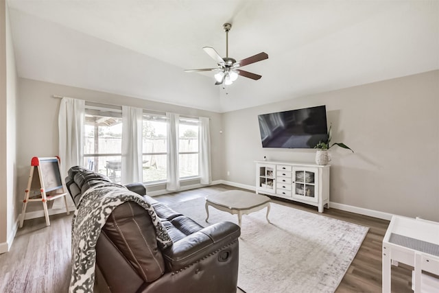 20810 Oak Rain Ct, Katy, TX 77449 - living area featuring lofted ceiling, baseboards, ceiling fan, and wood finished floors