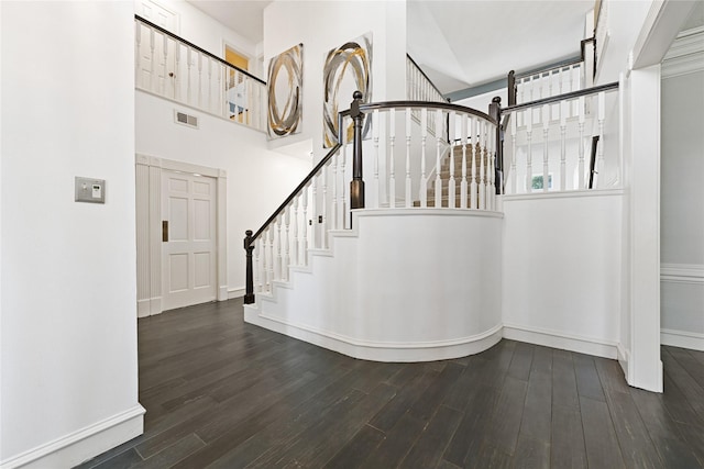 17414 Naremore Ct, Spring, TX 77379 - staircase featuring wood finished floors, a high ceiling, and baseboards