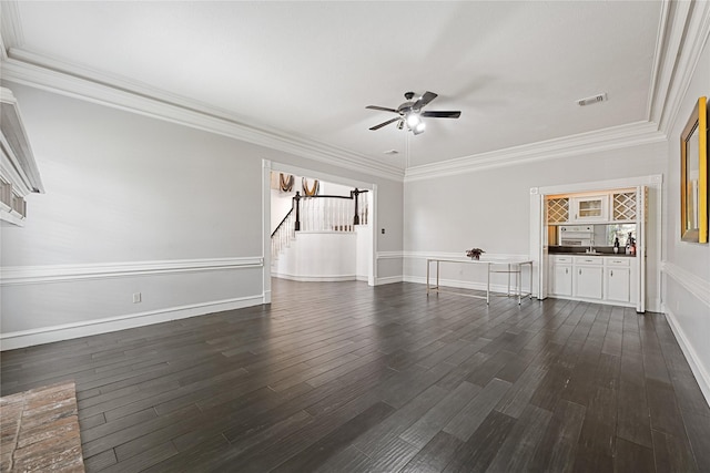 17414 Naremore Ct, Spring, TX 77379 - spare room featuring ceiling fan, dark wood-type flooring, crown molding, baseboards, and stairway