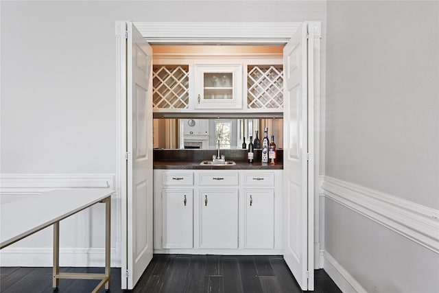 17414 Naremore Ct, Spring, TX 77379 - indoor wet bar with dark wood-style floors