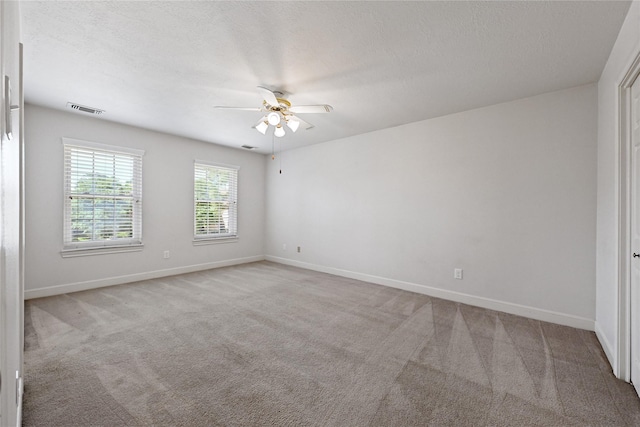 17414 Naremore Ct, Spring, TX 77379 - unfurnished room featuring ceiling fan, carpet flooring, baseboards, and a textured ceiling
