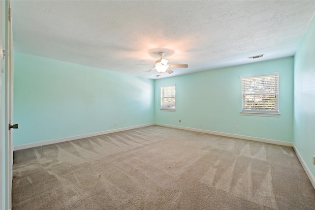 17414 Naremore Ct, Spring, TX 77379 - carpeted spare room with ceiling fan, baseboards, and a textured ceiling