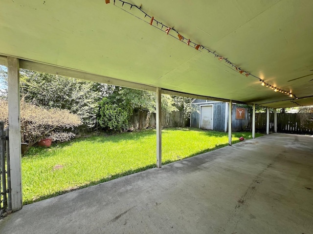 703 W Park St, Vidor, TX 77662 - view of patio featuring a shed and an outdoor structure