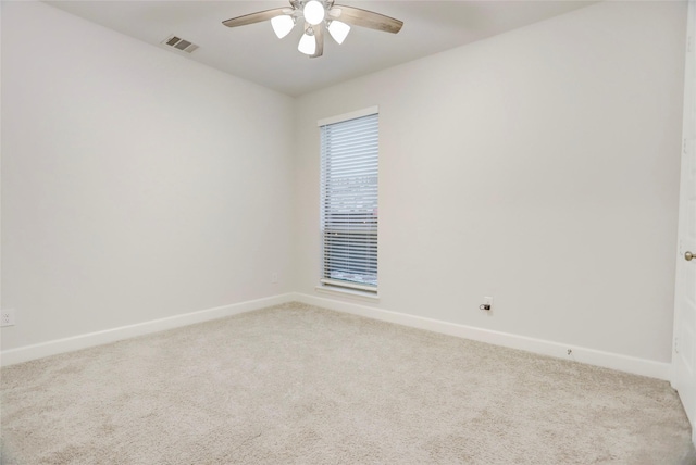 2327 Partridgeberry Ln, Katy, TX 77494 - spare room featuring light colored carpet, baseboards, and ceiling fan