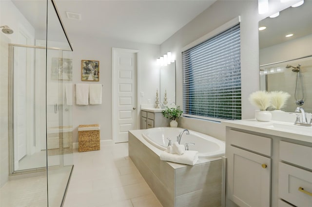2327 Partridgeberry Ln, Katy, TX 77494 - bathroom with a shower stall, a garden tub, vanity, and tile patterned floors