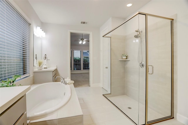 2327 Partridgeberry Ln, Katy, TX 77494 - full bath with a shower stall, a bath, vanity, a ceiling fan, and tile patterned flooring