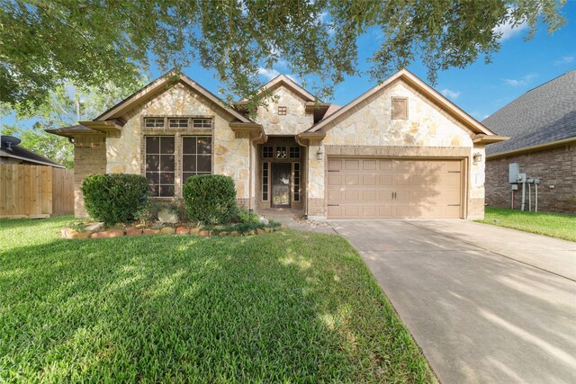 21606 Hansom Dr, Porter, TX 77365 - view of front of house with stone siding, an attached garage, and driveway