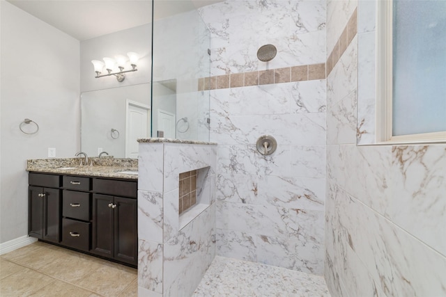 21606 Hansom Dr, Porter, TX 77365 - bathroom featuring a walk in shower, double vanity, and baseboards