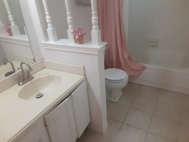 4927 Algernon Dr, Spring, TX 77373 - full bathroom with tile patterned flooring, vanity, toilet, and shower / bath combo with shower curtain