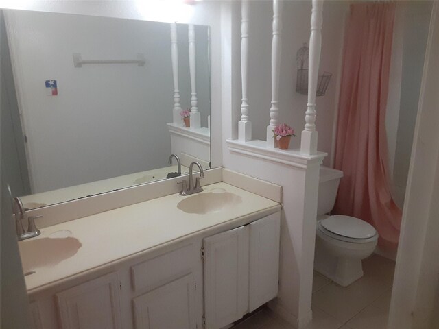 4927 Algernon Dr, Spring, TX 77373 - full bath featuring toilet, tile patterned flooring, double vanity, and a shower with curtain