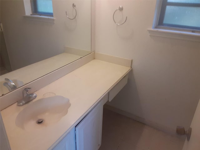 4927 Algernon Dr, Spring, TX 77373 - bathroom with healthy amount of natural light, baseboards, vanity, and tile patterned flooring
