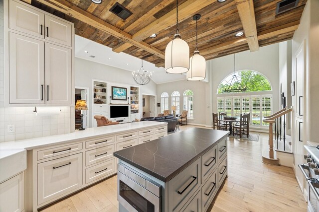 4323 Colony W Dr, Richmond, TX 77406 - kitchen with wooden ceiling, stainless steel appliances, open floor plan, beam ceiling, and light wood finished floors