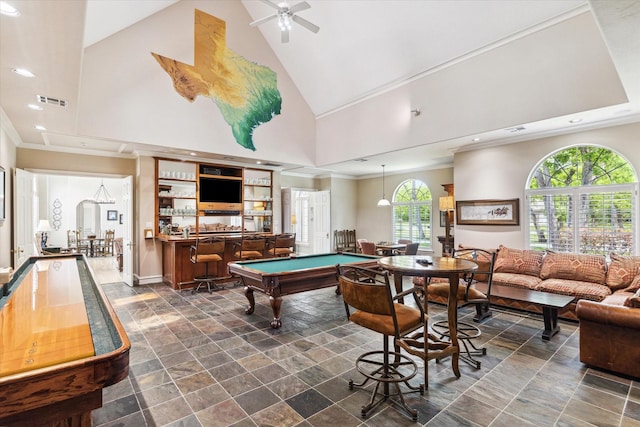 4323 Colony W Dr, Richmond, TX 77406 - game room with dark stone finish floors, recessed lighting, ornamental molding, a community bar, and high vaulted ceiling