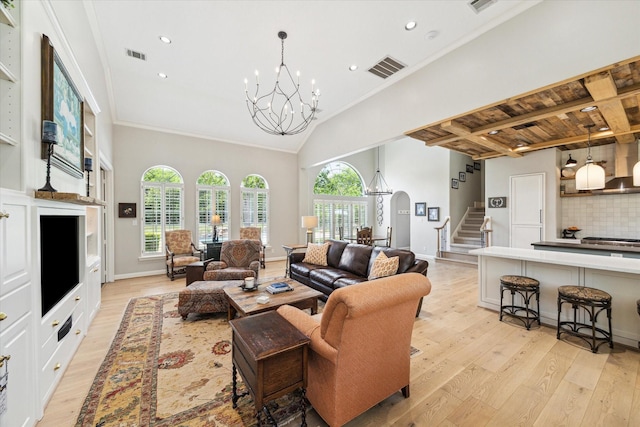 4323 Colony W Dr, Richmond, TX 77406 - living room with a chandelier, light wood-style flooring, stairway, recessed lighting, and arched walkways