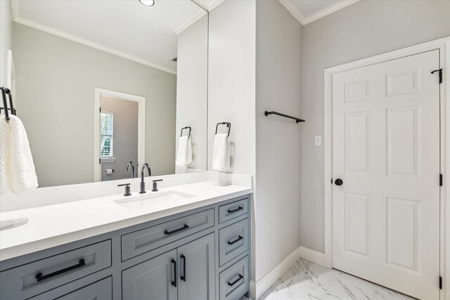 4323 Colony W Dr, Richmond, TX 77406 - bathroom featuring crown molding, marble finish floors, double vanity, and baseboards