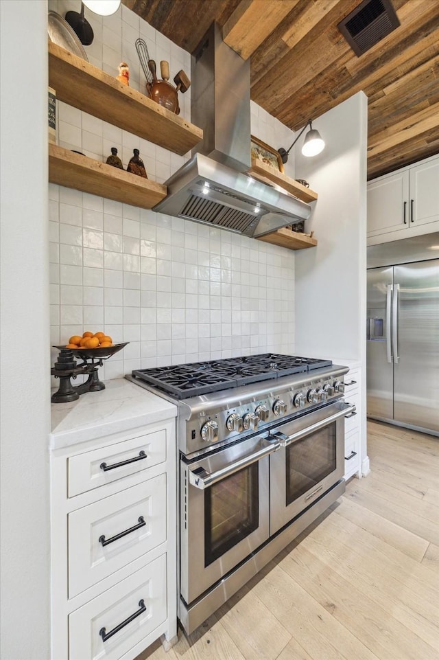 4323 Colony W Dr, Richmond, TX 77406 - kitchen with open shelves, stainless steel appliances, island range hood, wooden ceiling, and light wood-type flooring