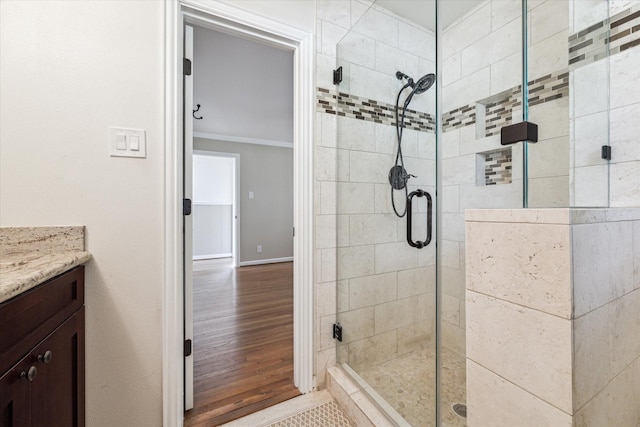 1803 Latexo Dr, Houston, TX 77018 - full bath with a stall shower, wood finished floors, vanity, baseboards, and crown molding
