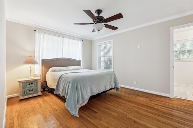 1803 Latexo Dr, Houston, TX 77018 - bedroom with crown molding, multiple windows, light wood-type flooring, and baseboards