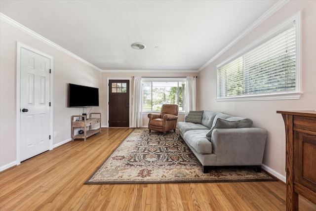 1803 Latexo Dr, Houston, TX 77018 - living room featuring wood finished floors, crown molding, and baseboards