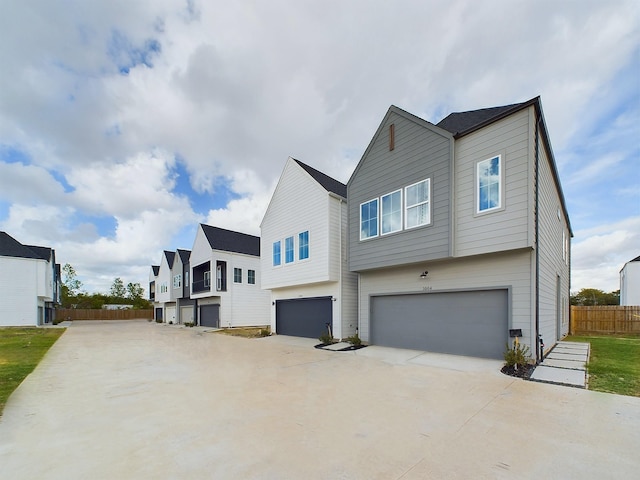 2710 Jensen Creek Ln, Houston, TX 77026 - view of front facade featuring an attached garage and concrete driveway